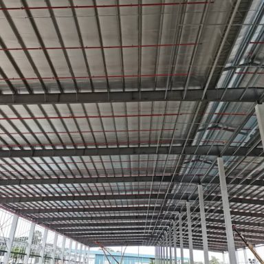 A project picture of jobsite showing the steel structure of purlins and metal roofing sheets with insulation aluminium foil sag rod gutter Juta Steel galvanised purlins Bumbung Besi JSC JSZ JutaDek 762 Metal Roofing Sheets Transparent Sheet PC roofing FRP roofing